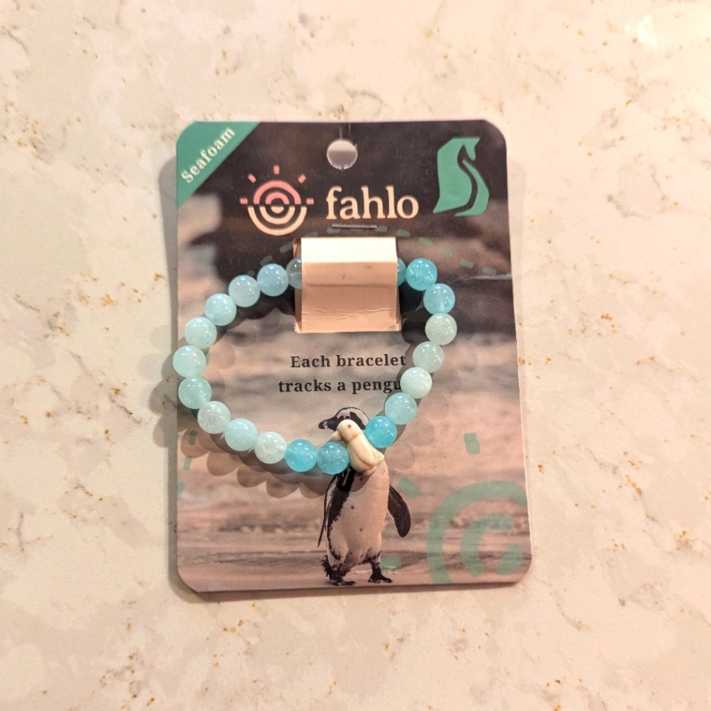 Fahlo Bracelet . This is a penguin bracelet with the seafoam colors .